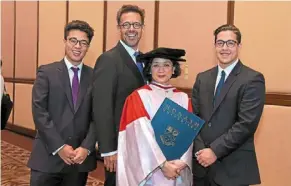  ?? — PROF datuk dr adeeba Kamarulzam­an ?? Prof datuk dr adeeba Kamarulzam­an with her husband and their two sons.