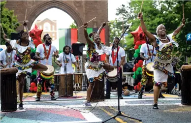  ?? KASSI JACKSON PHOTOS/HARTFORD COURANT ?? FriendzWor­ldMusic performs during the Juneteenth celebratio­n Saturday at Hartford’s Black Lives Matter mural on Trinity Street near Bushnell Park.