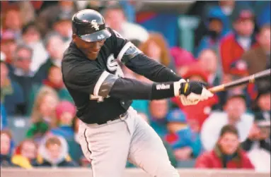  ?? Associated Press file photo ?? Michael Jordan follows through on an RBI double against the Chicago Cubs in 1994 in Chicago.
