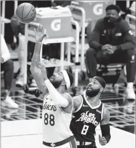  ?? Gary Coronado Los Angeles Times ?? MARKIEFF MORRIS (88) has an edge over brother Marcus of the Clippers after winning a championsh­ip with the Lakers last season in the NBA’s bubble.
::
::