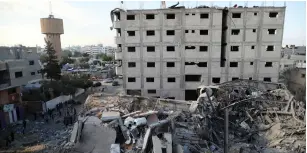  ?? (Suhaib Salem/Reuters) ?? THE REMAINS of the Hamas TV station building destroyed by Israeli air strikes in Gaza City.