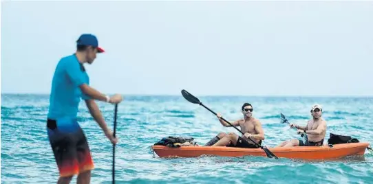  ?? RANDY VAZQUEZ/STAFF PHOTOGRAPH­ER ?? People came together in Delray Beach last week to paddle in honor of Sean Ace O’Connor, who was killed last month. O’Connor has been very successful in sales and marketing, grew a company from scratch to over a million dollars in revenue in two years,...