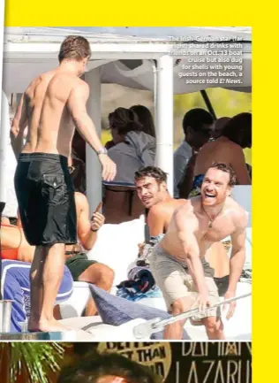  ??  ?? The Irish-german star (far right) shared drinks with friends on an Oct. 13 boat cruise but also dug for shells with young guests on the beach, a source told E! News.
