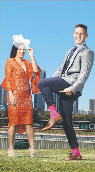  ?? Picture: GLENN HAMPSON ?? Models Verity Haylen and Callym Beric wearing clothes to showcase the new Fashions on the Field categories this Melbourne Cup Day at the Gold Coast Turf Club.