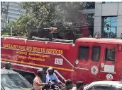  ?? — R. PAVAN ?? Onlookers were puzzled to see a ‘Tamil Nadu Fire Services’ truck arrive at the Himark Chambers at Khajaguda Crossroads, Raidurgam, on Saturday. Fire department officials later said that the vehicle had been lent for the shooting of a Tamil film, whose crew had painted it over.