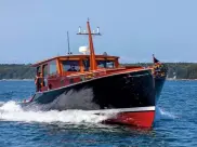  ??  ?? B E L O W : Although it looks every inch a classic craft, it performs, cossets and handles just like a modern GRP boat