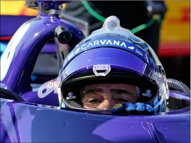  ?? DARRON CUMMINGS — THE ASSOCIATED PRESS ?? Jimmie Johnson climbs out of his car following practice May 14 at Indianapol­is Motor Speedway in Indianapol­is.