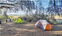  ?? PATRICK CONNOLLY/ORLANDO SENTINEL ?? Tents are set up for camping at Hopkins Prairie