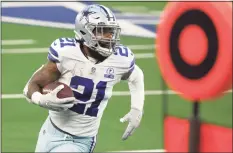  ?? Ron Jenkins / Associated Press ?? Dallas Cowboys running back Ezekiel Elliott against the Philadelph­ia Eagles in an NFL game in Arlington, Texas, on Sunday. Elliott has persevered through one of his roughest seasons to date.