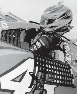  ?? SEAN GARDNER/GETTY-AFP ?? Bubba Wallace gets in his car Sunday during Daytona 500 qualifying.