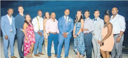  ??  ?? The groom, Dr Michael Daley (centre), flanked by his friends, who are mainly members of the medical fraternity who flew in from the United States to share his special day in his homeland.