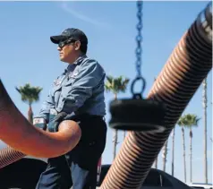  ?? JAE C. HONG, AP ?? Rudy Rocha delivers gas to a Costco in Tustin, Calif., on Oct. 5. Nationally, regular gas averages $3.76 a gallon, but it’s over $4 many places.