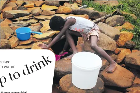  ?? Photo: Sechaba Mokhethi ?? A girl draws water from an unprotecte­d well near Ha Ino village.