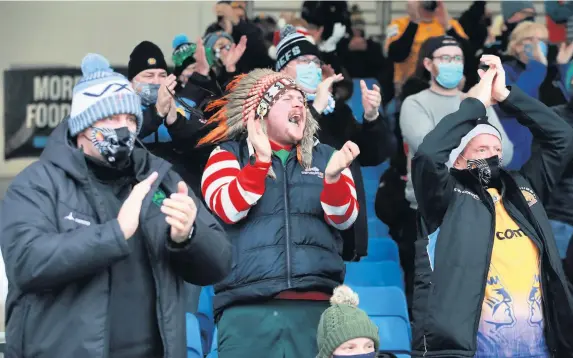  ?? David Rogers ?? > Exeter Chiefs fans show their support as they return to the stadium for the first time since March for their clash against Glasgow in December