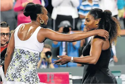  ?? /USA TODAY Sports ?? Sister act: Venus Williams, left, and sister Serena after their thirdround match at Indian Wells, which Venus won to progress to the last 16.