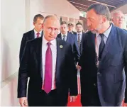  ?? [ASSOCIATED PRESS FILE PHOTO] ?? Russia’s President Vladimir Putin, left, and Russian metals magnate Oleg Deripaska, right, walking to attend the APEC Business Advisory Council dialogue Nov. 10 in Danang, Vietnam.