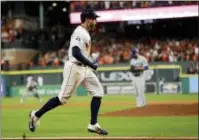  ?? MATT SLOCUM — THE ASSOCIATED PRESS ?? Houston Astros’ George Springer celebrates after a home run off Los Angeles Dodgers relief pitcher Brandon Morrow during the seventh inning of Game 5 of the World Series Sunday in Houston.