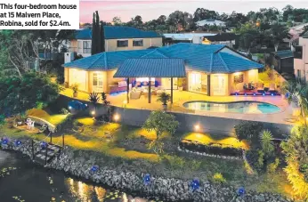  ?? ?? This four-bedroom house at 15 Malvern Place, Robina, sold for $2.4m.