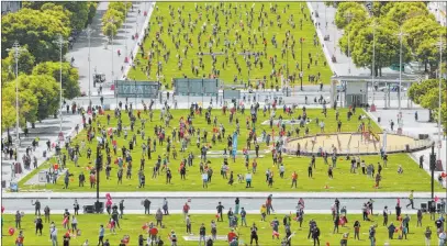  ?? Armando Franca The Associated Press ?? Union members keep a safe distance from one another and wear face masks to help protect against the spread of the new coronaviru­s during a May Day event Friday in Lisbon, Portugal. May Day is a state holiday in many countries.