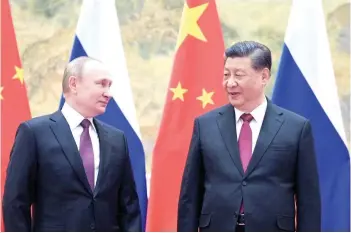  ?? — AFP photo ?? Putin and Xi Jinping pose for a photograph during their meeting in Beijing.