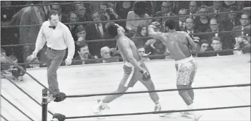  ??  ?? Joe Frazier (right) lands a left hook on Muhammad Ali during the first of their three epic battles at Madison Square Garden in New york City, New york, in this March 8, 1971 file photo. — Reuters photo