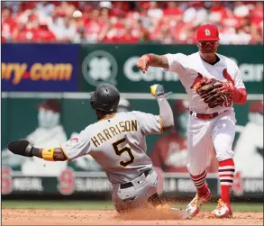  ?? Associated Press ?? Trying to turn two: Pittsburgh's Josh Harrison (5) is out as St. Louis second baseman Kolten Wong is unable to turn the double play during the sixth inning of their game Wednesday in St. Louis.