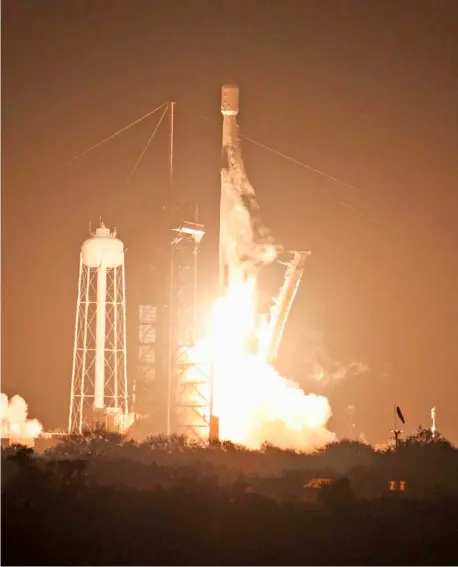  ?? GREGG NEWTON/AGENCE FRANCE-PRESSE ?? Moon-bound A SpaceX Falcon 9 rocket lifts off from launch pad LC-39A at the Kennedy Space Center with the Intuitive Machines’ Nova-C moon lander mission, in Cape Canaveral, Florida, on Thursday.The IM-1 mission is part of NASA’s Commercial Lunar Payload Services program to understand more about the Moon’s surface ahead of the coming Artemis missions.