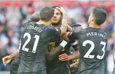  ??  ?? Newcastle United’s English defender Jamaal Lascelles (C) celebrates scoring his team’s first goal with teammates Newcastle United’s Spanish striker Mato Joselu (L) and Newcastle United’s Spanish midfielder Mikel Merino (R) during the English Premier...
