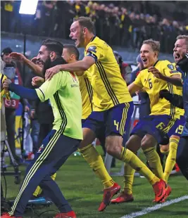  ?? (AFP) ?? Sweden players celebrate after defeating Italy in the European playoffs for Russia World Cup on Monday