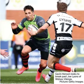  ??  ?? Gavin Henson looks to break past Joe Lyons of Widnes Vikings.
Picture: Getty Images