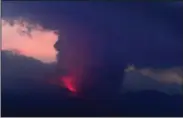  ?? (AP/Kyodo News) ?? This long exposure image shows the eruption of volcano Sakurajima Sunday night, in the view from Tarumizu city, Japan’s southern prefecture of Kagoshima.