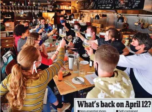  ??  ?? Cheers! Indoor dining like this will resume on May 17, but from this coming Monday you can eat and drink outside