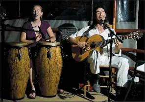  ?? Special to the Democrat-Gazette ?? The GinSingers — Stefanie Behe (left) and Joey de Lago — perform Friday at South on Main.