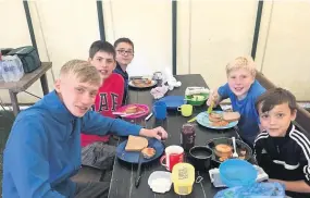  ??  ?? Lunch time Harry Tyler, Patrick Scott, Ruari Fleming, Findlay Spence and Callum McDiarmid dine in the marquee