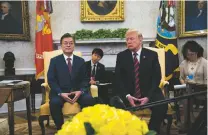  ?? DOUG MILLS/NEW YORK TIMES ?? President Moon Jae-in of South Korea, left, meets with President Donald Trump at the White House on Tuesday. Trump said Friday his administra­tion was back in touch with North Korea and the summit might be reschedule­d.