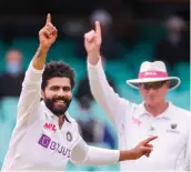  ?? AFP ?? India’s Ravindra Jadeja ( left) celebrates after taking the wicket of Australia’s Nathan Lyon during Day Two of the third Test match at the Sydney Cricket Ground on Friday. —