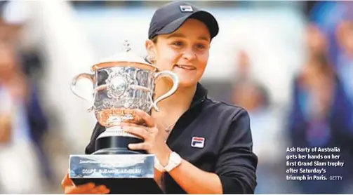  ?? GETTY ?? Ash Barty of Australia gets her hands on her first Grand Slam trophy after Saturday’s triumph in Paris.