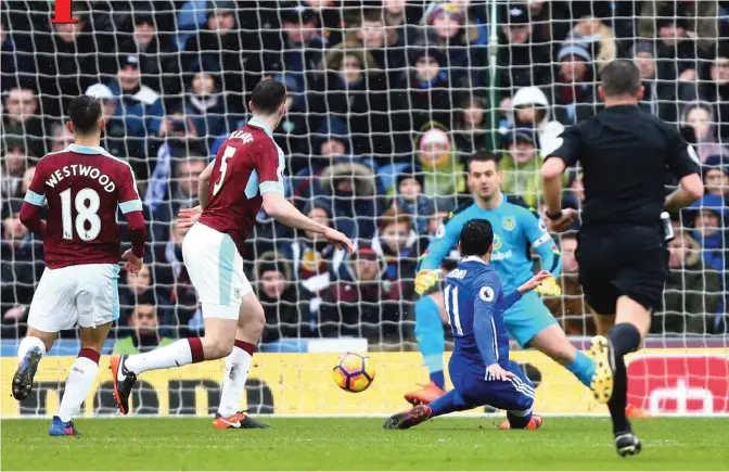  ??  ?? BURNLEY: Chelsea’s Pedro, centre, scores his side’s first goal during the English Premier League soccer match between Burnley and Chelsea at Turf Moor stadium in Burnley, England, yesterday. — AP