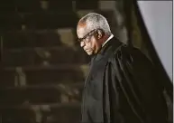  ?? Jonathan Newton / The Washington Post ?? Justice Clarence Thomas pauses after administer­ing the oath of office to Judge Amy Coney Barrett at the White House on Oct. 26, 2020.