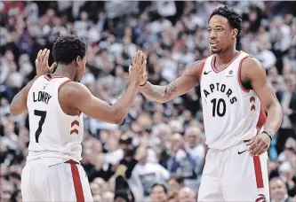  ?? NATHAN DENETTE THE CANADIAN PRESS ?? Raptors’ Kyle Lowry and teammate DeMar DeRozan (10) celebrate a basket against the Washington Wizards in Toronto on Tuesday. Dwane Casey remembers the “powwow” he had with DeRozan and Lowry.