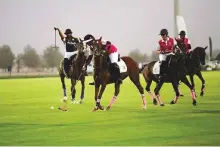  ?? GRPL ?? Action from the Pink Polo Day at the Ghantoot Racing &amp; Polo Club between Ghantoot A ladies team and Ghantoot B.