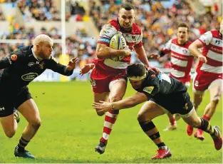  ??  ?? Half-time lead: Tom Marshall runs in to score Gloucester’s third try