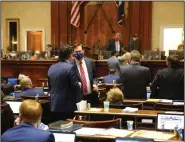  ?? (AP/Jeffrey Collins) ?? South Carolina House Majority Leader Gary Simrill (center, left) and House Speaker Jay Lucas confer Wednesday in Columbia before the passage of the abortion bill.