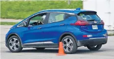  ?? LESLEY WIMBUSH/DRIVING ?? The 2017 Chevrolet Bolt’s quick accelerati­on is an advantage on a motorsport course.