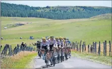  ?? [CHRISTOPHE ENA/THE ASSOCIATED PRESS] ?? The pack led by team Sky and Britain’s Chris Froome rides during the 15th stage of the Tour de France on Sunday.