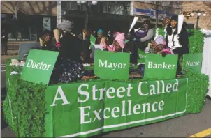  ?? The Sentinel-Record/Richard Rasmussen ?? AN EXCELLENT FLOAT: Members of Union Missionary Baptist Church ride along Central Avenue Monday morning on a float themed “A Street Called Excellence” as part of the annual Martin Luther King Day Parade through downtown.