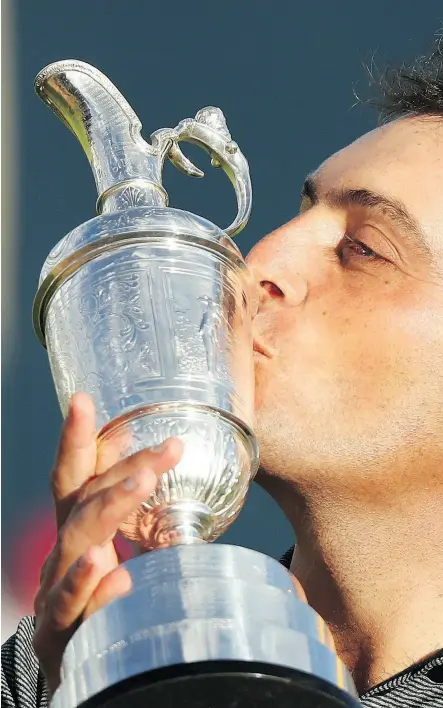  ?? PETER MORRISON / THE ASSOCIATED PRESS ?? Francesco Molinari of Italy has a kiss for the Claret Jug after winning the 147 th British Open title by two strokes Sunday in Carnoustie, Scotland.