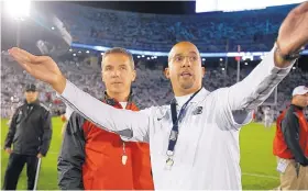  ?? AP FILE ?? Penn State coach James Franklin, right, showing off the Nittany Lions’ stadium to Ohio State’s Urban Meyer in 2014, will be on opposite sidelines again Saturday.