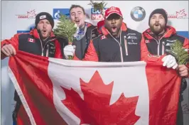  ?? The Canadian Press ?? From left, second-place finishers Justin Kripps, of Summerland, and Alexander Kopacz, of London, Ont., and first-place finishers Neville Wright, of Edmonton, and Chris Spring, of Calgary, celebrate following a two-man World Cup bobsled race in Whistler...