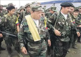  ?? Scott Dalton Associated Press ?? FARC FOUNDER Manuel Marulanda, center, and his No. 2, Mono Jojoy, right, in 2000. Marulanda died of natural causes in 2008. Jojoy was killed in 2010.